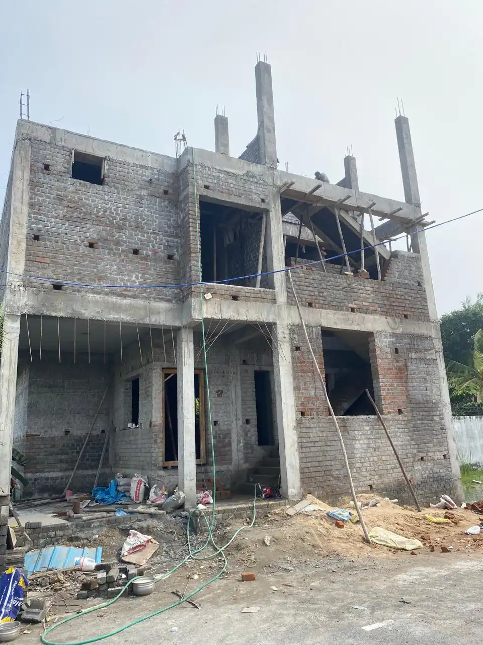 Two-storey concrete frame with block walls under construction, Paruthipattu / Avadi site