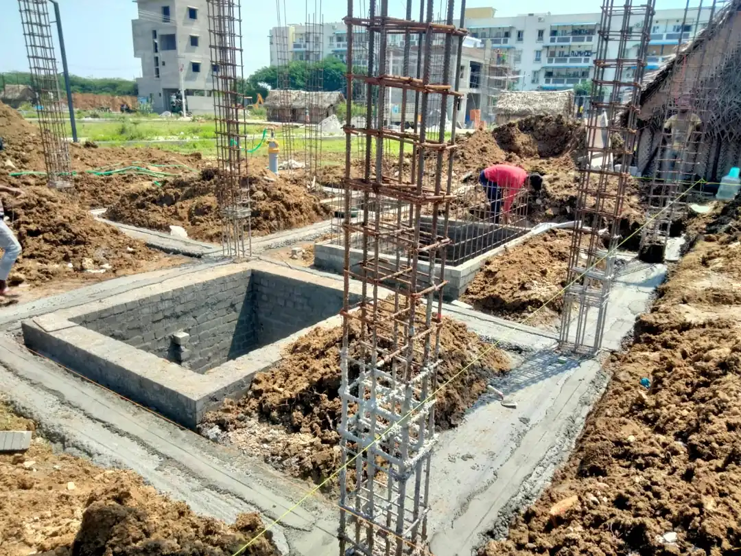 Pedestals and plinth blockwork with column cages during soil filling, Avadi site