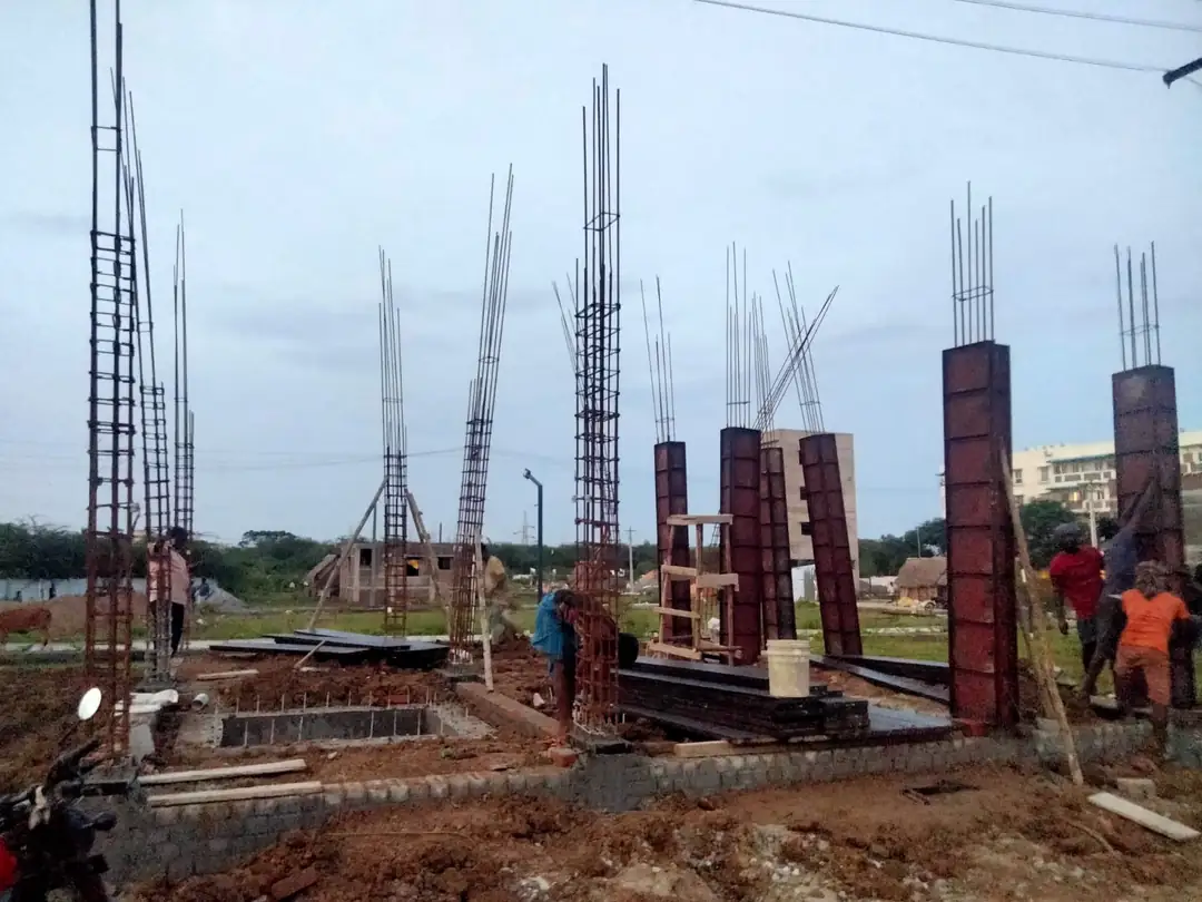 Column formwork and starter bars rising above the plinth beam, Avadi site